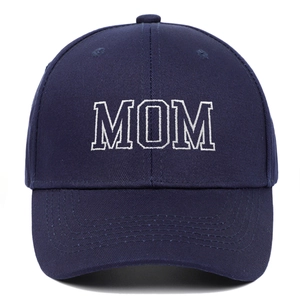 Close-up of MOM white embroidery on navy blue cotton twill baseball cap with peak detail