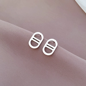 Minimalist silver titanium steel pig nose stud earrings with a high-polished mirror finish