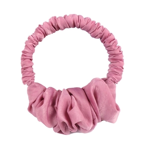 Detail of pink silk-like heatless hair curler featuring elegant pleated fabric texture
