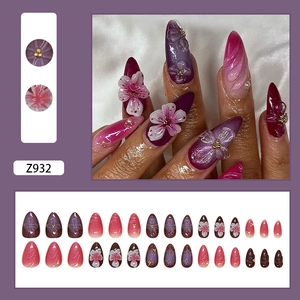 3D floral purple press-on nails with cat-eye effect and pearl accents long almond shape