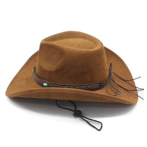 Detail of brown suede cowboy hat featuring turquoise stone leather band and chin strap