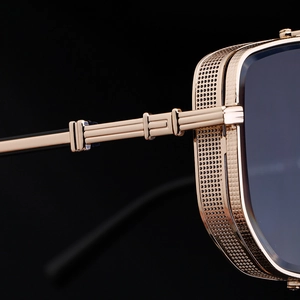 Macro detail of golden metal hinge and mesh side shield on punk square sunglasses