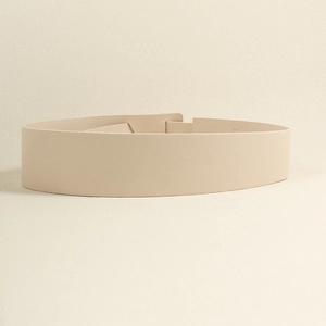 Minimalist wide PU leather knotted belt in beige, showing smooth texture and elegant detail