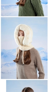 Detail view of winter balaclava with plush faux fur trim and cozy knitted texture
