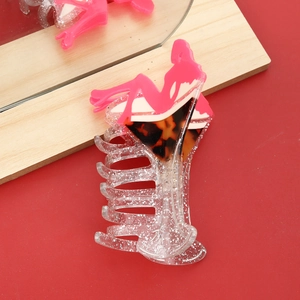 Acetate shark hair claw in martini glass shape with tortoiseshell and pink silhouette