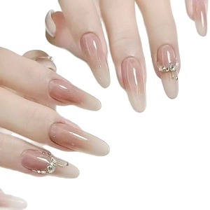 Long oval nude gradient press-on nails with 3D water drops and crystal rhinestones