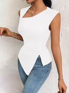 Detail of white asymmetric hem and waist pleats on an elegant slim-fit top