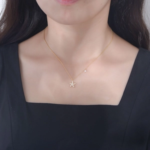 S925 silver starfish pendant necklace with pavé diamonds and pearl on a gold chain