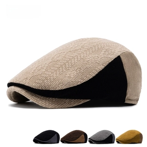 Men's retro color-block knit beret showing textured beige and black patchwork design