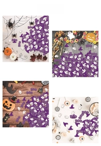 Close-up of Halloween ghost wizard hat and BOO confetti scattered on a desktop