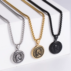 Detailed close-up of Queen Elizabeth II coin pendants in gold, silver and black finishes
