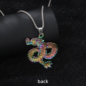 Rainbow stainless steel dragon necklace pendant showing the back view on a dark texture