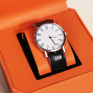 Quartz watch with black leather strap in a premium orange textured gift box