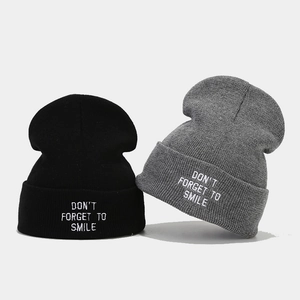 Black and grey knit beanies with Don't Forget To Smile letter embroidery detail