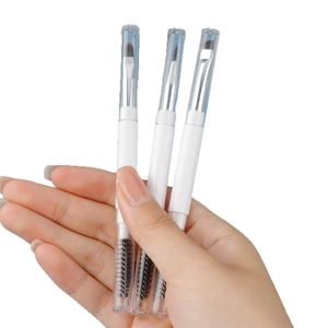 Three-piece double-ended eyebrow brush set with spoolie and flat angled brush with caps