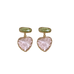 Elegant heart-shaped crystal drop earrings with gold-plated edges and pink stones