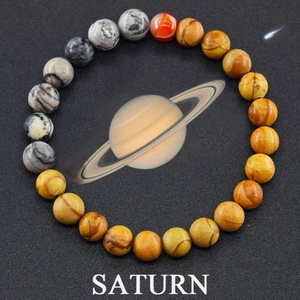 Detail view of Saturn solar system bead bracelet with natural tiger eye and planet stone
