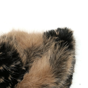 Macro shot of high-quality brown and black gradient faux fur texture on winter bucket hat