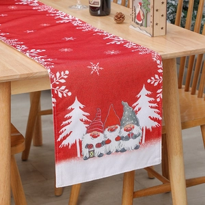 Christmas table runner with red burlap texture, gnome and snowflake holiday patterns