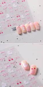 Detail of TS-3848 nail art stickers with pink bows and cherry designs on nails