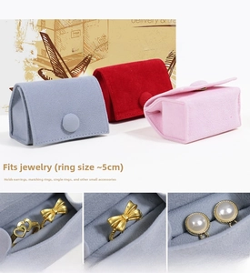 Detailed view of velvet jewelry pouch internal storage slot with snap button closure