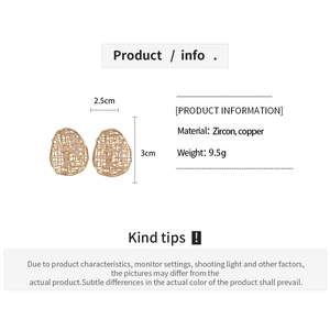 Detail view of 18k gold plated hollow oval earrings with dimensions and zircon inlay