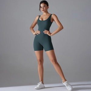 Detail of slim fit dark green sports romper showing V-shape back and high elastic fabric