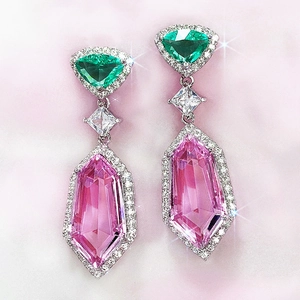 Pink teardrop crystal drop earrings with green triangular stones and silver metal plating