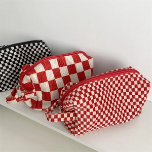 Checkerboard velvet cosmetic bag set with textured fabric and top handle for storage