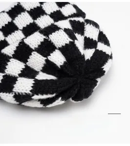 Macro shot of the sturdy knitted crown on a checkerboard beanie showing tight stitching