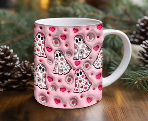 Close-up of pink ceramic Halloween mug with 3D ghost, daisy, and heart patterns
