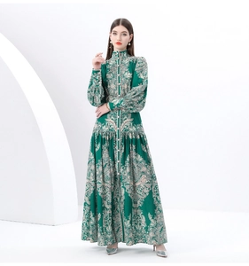 Detail of vintage green floral maxi dress featuring a high collar and lantern sleeves
