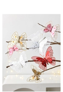 Detailed macro view of colorful sequined butterfly hair clips with lace and mesh texture