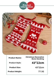 Detail view of 43x22cm knitted bone-shaped Christmas stocking with snowflake patterns