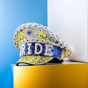 Macro shot of sparkling sequins and BRIDE rhinestone lettering on a captain hat