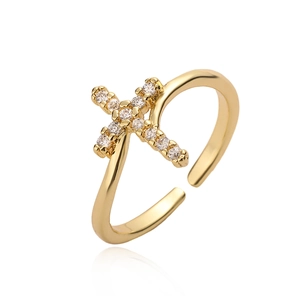 Cross gold-plated adjustable ring with micro-pave cubic zirconia on a white background