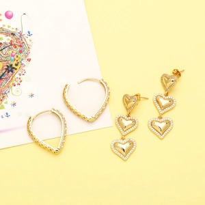 Elegant gold heart hoop earrings and triple dangling studs with sparkling micro-insets