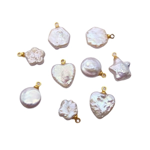 Assorted baroque freshwater pearl pendants in star and heart shapes with gold loops