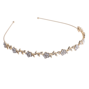 Elegant gold flower headband with rhinestones and leaf design for bridal wedding hairstyle