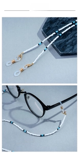 Detail of beaded eyewear chain featuring white pearls and colorful accents with silicone loops
