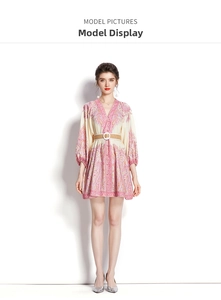 Detail of V-neck floral mini dress with lantern sleeves and a woven waist belt decoration
