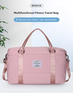 Detail view of pink quilted yoga gym bag featuring dual handles and adjustable shoulder strap