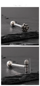 Detail of silver rose stud and microphone barbell stud with measurements in cm