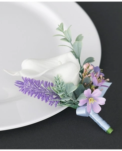 Detailed view of calla lily boutonniere with purple lavender and light blue ribbon wrapping