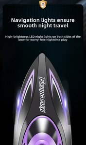 Detail of streamlined RC boat bow with glowing LED night navigation lights and purple trim