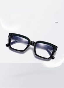 Close-up of lightweight black square frame reading glasses weighing 34g with spring hinges