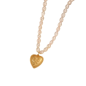 Elegant natural freshwater pearl necklace featuring a vintage gold rose heart pendant
