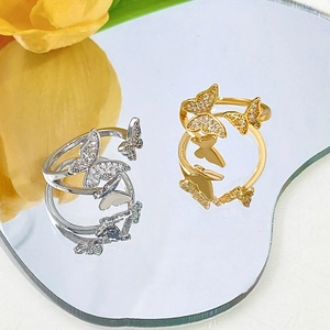 Adjustable open butterfly ring set in gold and silver finish with sparkling zircons