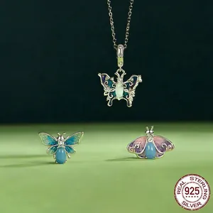 Luminous butterfly jewelry set in 925 sterling silver with blue enamel and opal stones