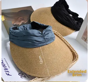 Detail view of woven sun hats with 12cm wide brim in blue-grey and black colors
